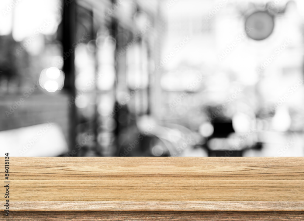 Aufkleber empty wood table top with coffee shop blur with bokeh background