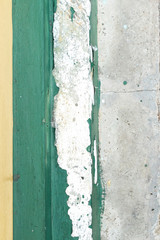 yellow erode painted concrete wall,grunge rough texture backgrou