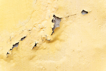 yellow erode painted concrete wall,grunge rough texture backgrou