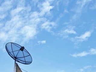 Satellite dish on the blue sky.