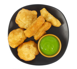 Dish of deep-fried doughstick on white background