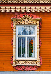 Fototapeta na wymiar Carved window of wooden house in historical town Kolomna - Russi