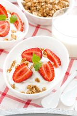 healthy breakfast - yogurt, strawberries and milk, top view
