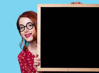 girl in red dress with blackboard