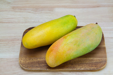 Mango on a wooden background