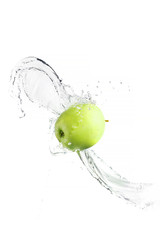 Green apple with water splash, isolated