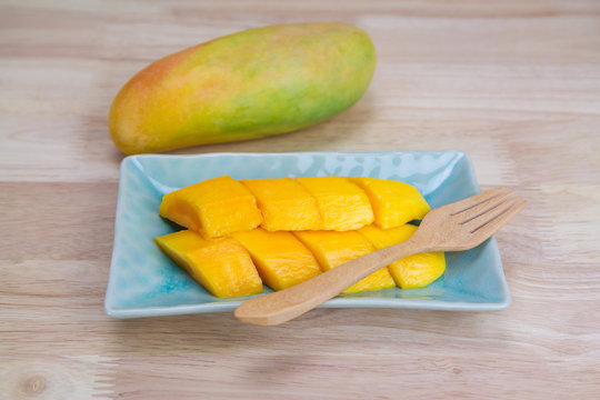 Mango on a wooden background