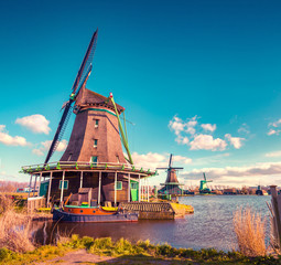 Authentic Zaandam mills on the water channel in Zaanstad village