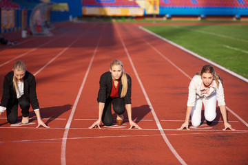 business people running on racing track