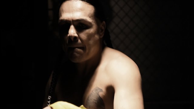 Native American athlete warms up by jumping up and down