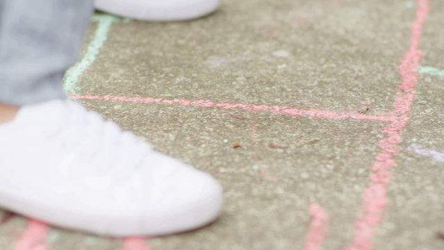 Chalk on the ground in a hopscotch pattern
