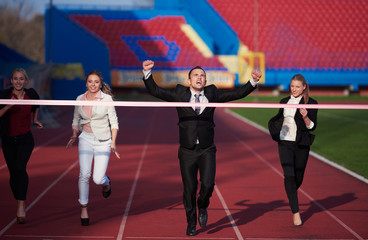business people running on racing track