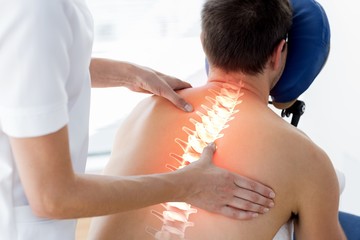 Highlighted spine of man at physiotherapy