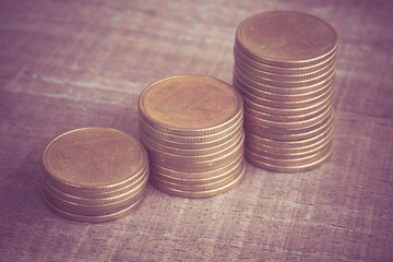 coins on wood with filter effect retro vintage style