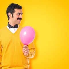 Twin brothers with balloons