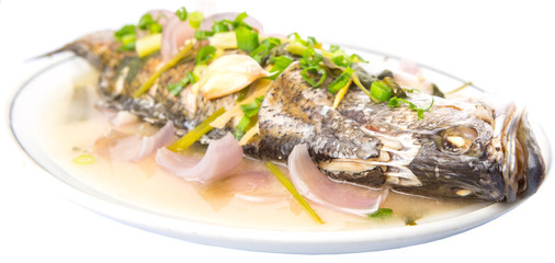 Malaysian dish of sweet and sour steamed Asian bass fish