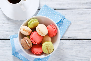Various macaroon in a bowl on the boards
