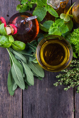 Fresh herbs from garden with olive oil