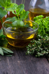 Fresh herbs from garden with olive oil