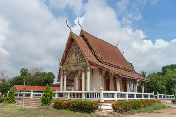 Fototapeta premium Temple with tree and sky background at Wat Sahakon Rangsan