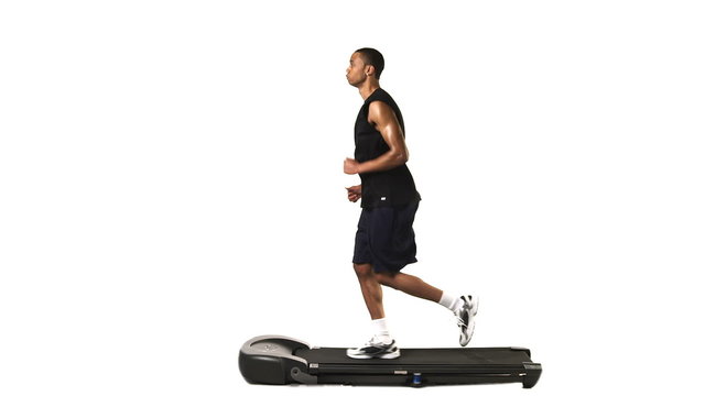 A ethnic man running on a treadmill