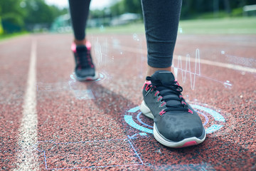 Fototapeta na wymiar close up of woman feet running on track