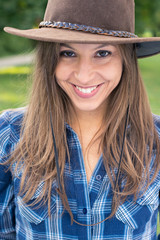 Brunette cowgirl smiling
