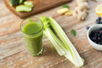 close up of fresh green juice glass and celery