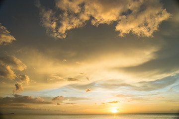 sunset on the sea with cloudy sky background