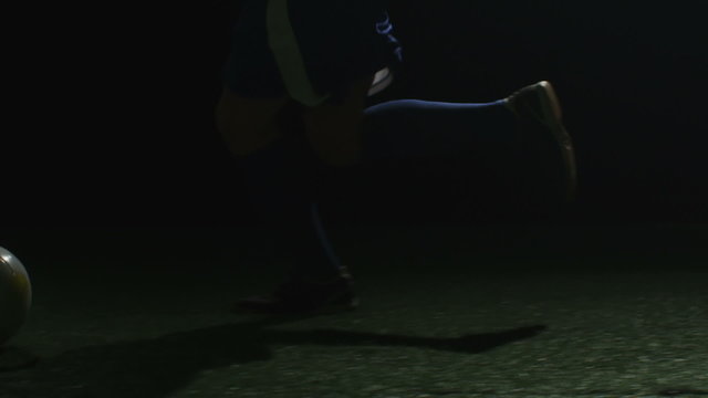 Close up view of a soccer player doing tricks with his feet and the ball