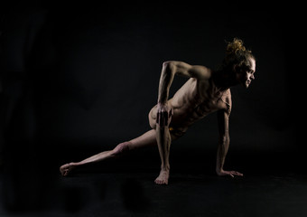 Obraz na płótnie Canvas Young man practicing yoga