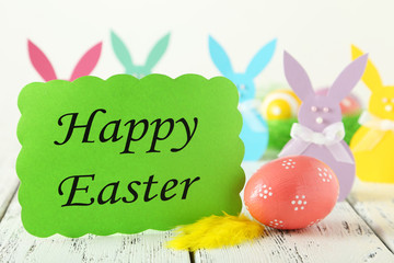 Beautiful easter rabbit on white wooden background