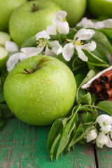 Green apples, mint and cinnamon on the table
