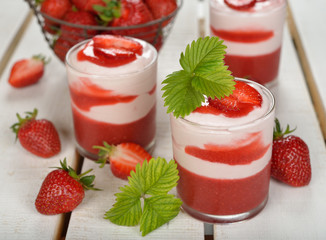 Dessert with strawberry jelly and whipped cream
