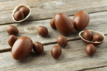 Chocolate easter eggs on grey wooden background