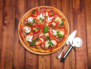 Pizza on wooden background