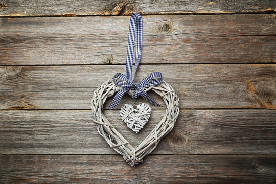 wooden heart decoration on grey background