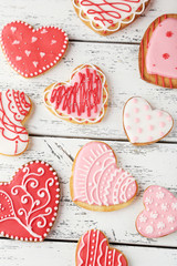 Heart cookies on white wooden background