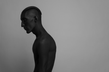 a man with black skin is isolated the Black Death body art
