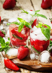 Strawberry cocktail with mint and ice, selective focus