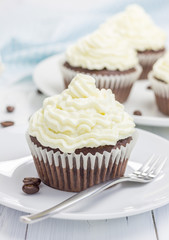Chocolate cupcakes with ricotta cheese frosting 