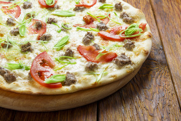 Delicious seafood pizza with tomatoes