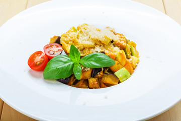 Traditional italian pasta with aubergine and zucchini