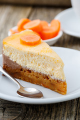 Sweet slice of carrot cake on white plate.