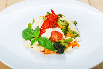Traditional italian colored pasta with vegetables