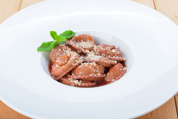 Red beetroot ravioli with blue cheese filling