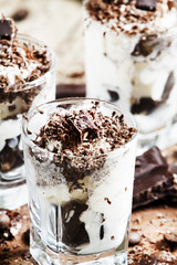 Chocolate dessert with ice cream in a glass, selective focus