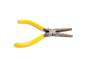 Rusty yellow pliers isolated on white