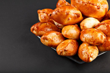 Hot tasty small russian pie on the plate