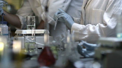 Close up of experiments being conducted in a chemistry lab - Powered by Adobe
